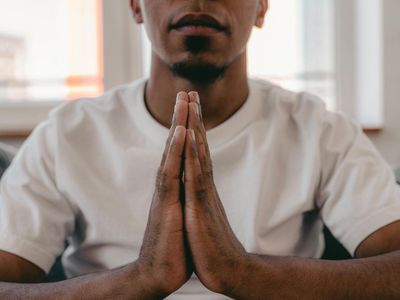 Close up of hands in a meditative position.