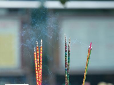 Incense sticks and a plant for relaxation.